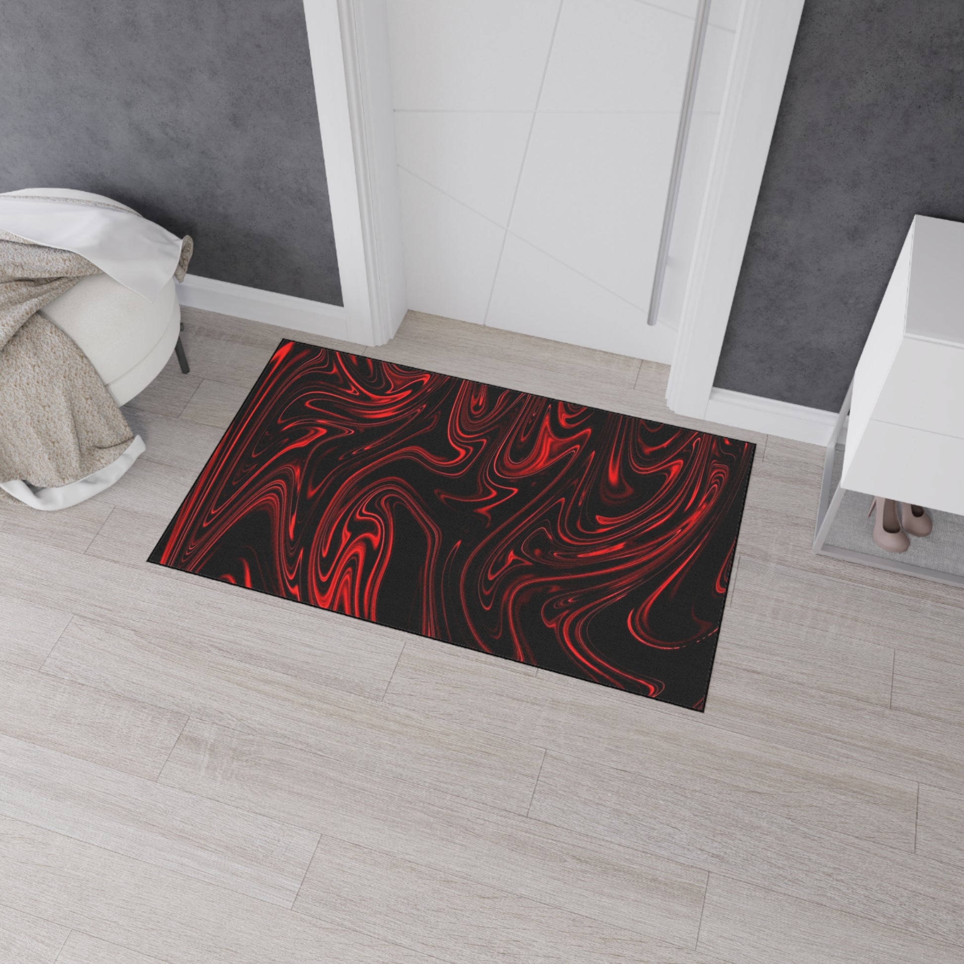 Decorative doormat with red and white abstract pattern on a wooden floor.
