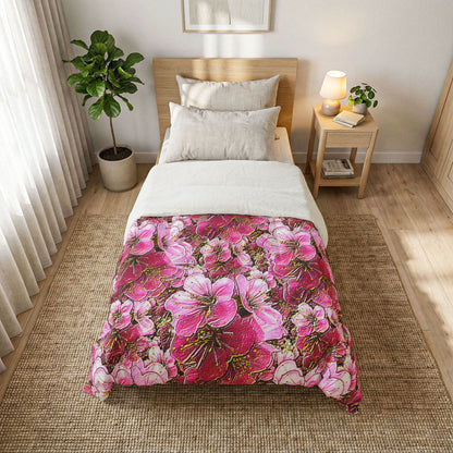 Vibrant pink and gold cherry blossom comforter on a Twin XL bed in a bright, minimalist room with light wood furniture and botanical wall art.