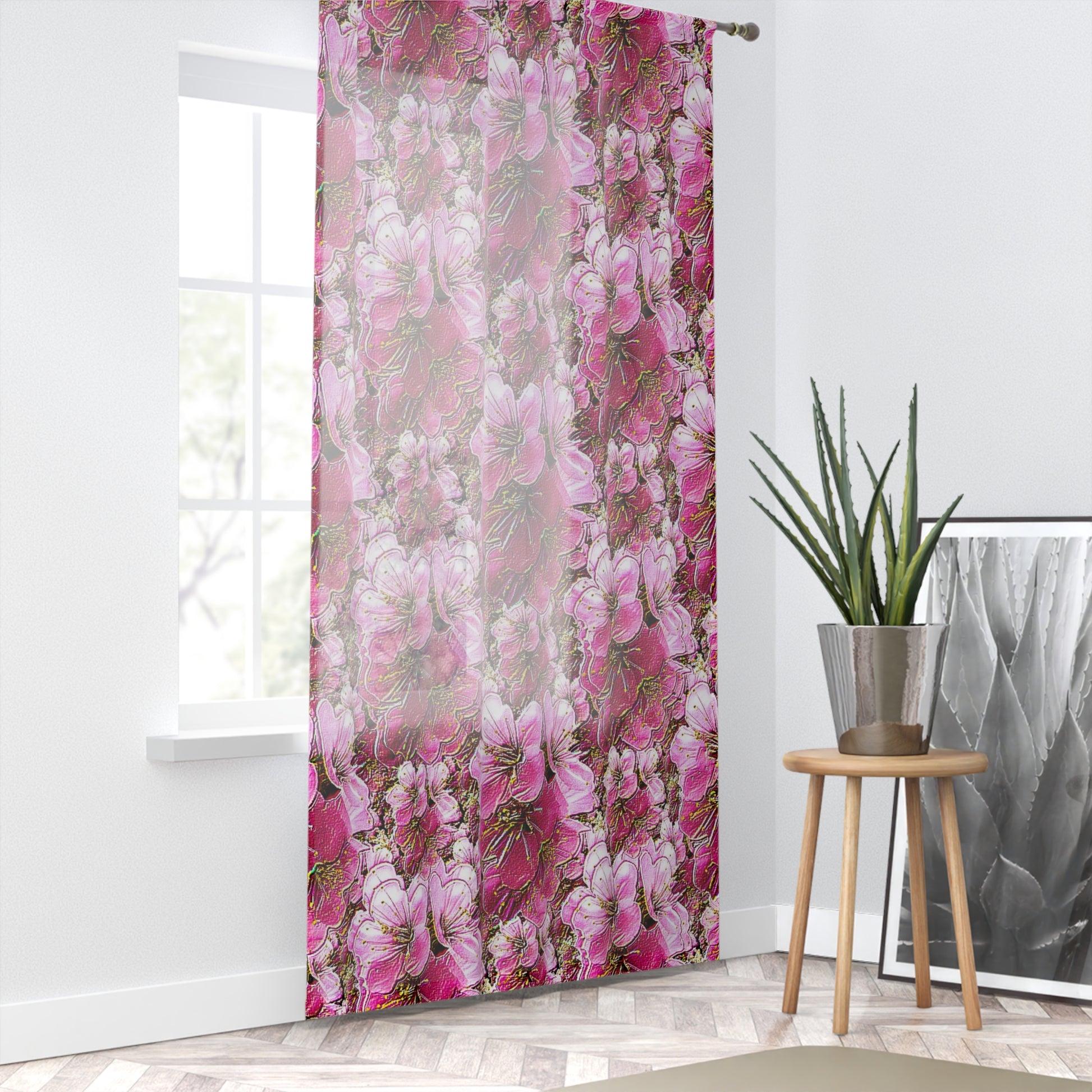 Bright, airy room with pink floral sheer curtains over a window, styled with a potted plant and a herringbone floor.
