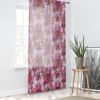 Bright, airy room with pink floral sheer curtains over a window, styled with a potted plant and a herringbone floor.