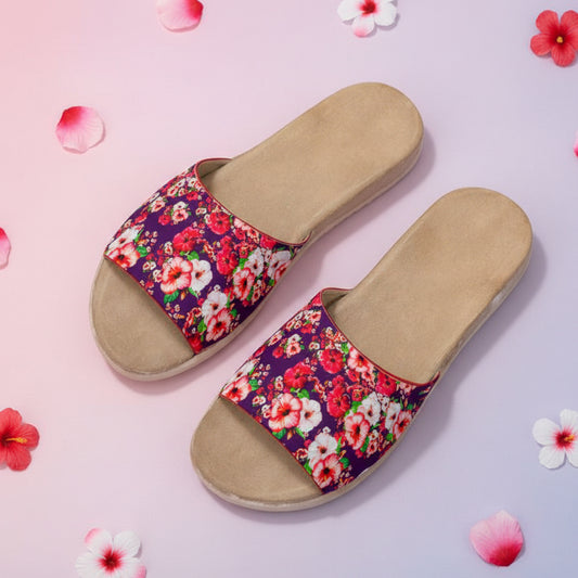 Pair of sandals with floral straps on a beige background