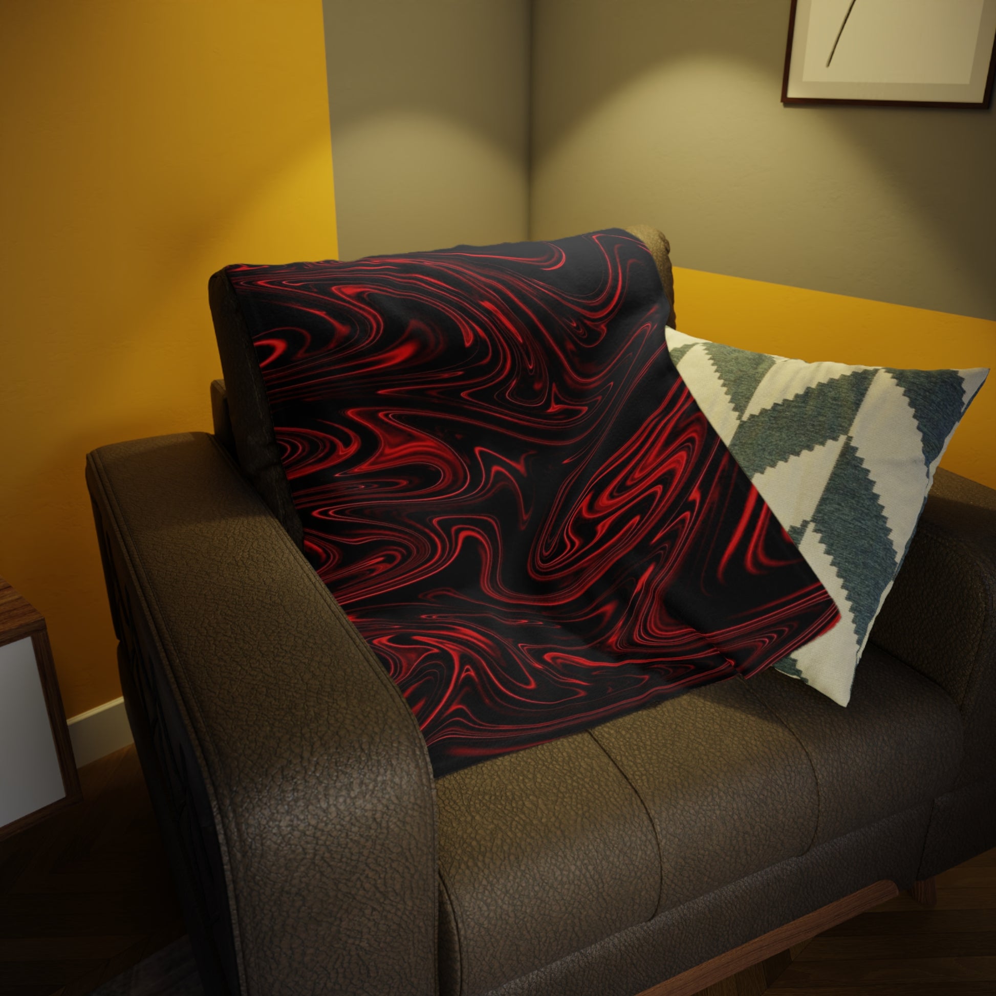 A red liquid marble patterned throw draped over a dark leather armchair in a modern living room with warm, moody lighting.