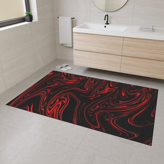 Black and red patterned bath mat on a bathroom floor with a sink and towel in the background.