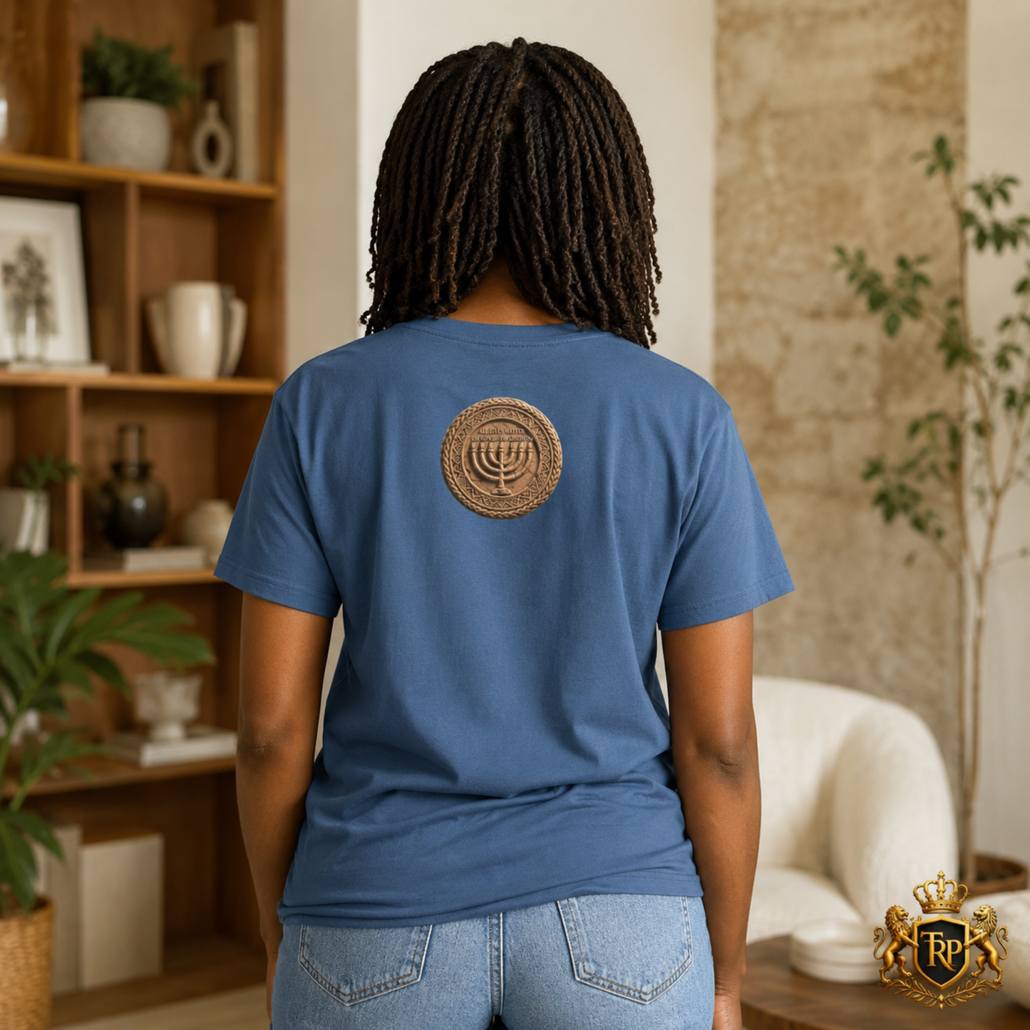 Back view of woman wearing a faded navy t-shirt displaying the Sevenfold Light Menorah circular emblem.