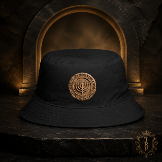 Front view of the black All Lives Matter bucket hat featuring The Sevenfold Light menorah emblem on a dark stone pedestal.