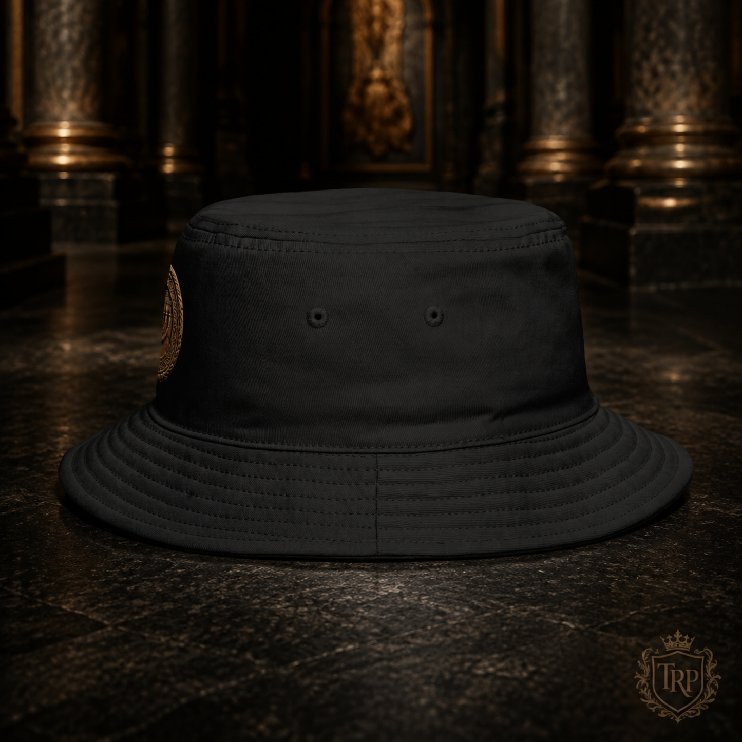 Side profile view of the black All Lives Matter bucket hat showing eyelet vents on a dark stone surface.