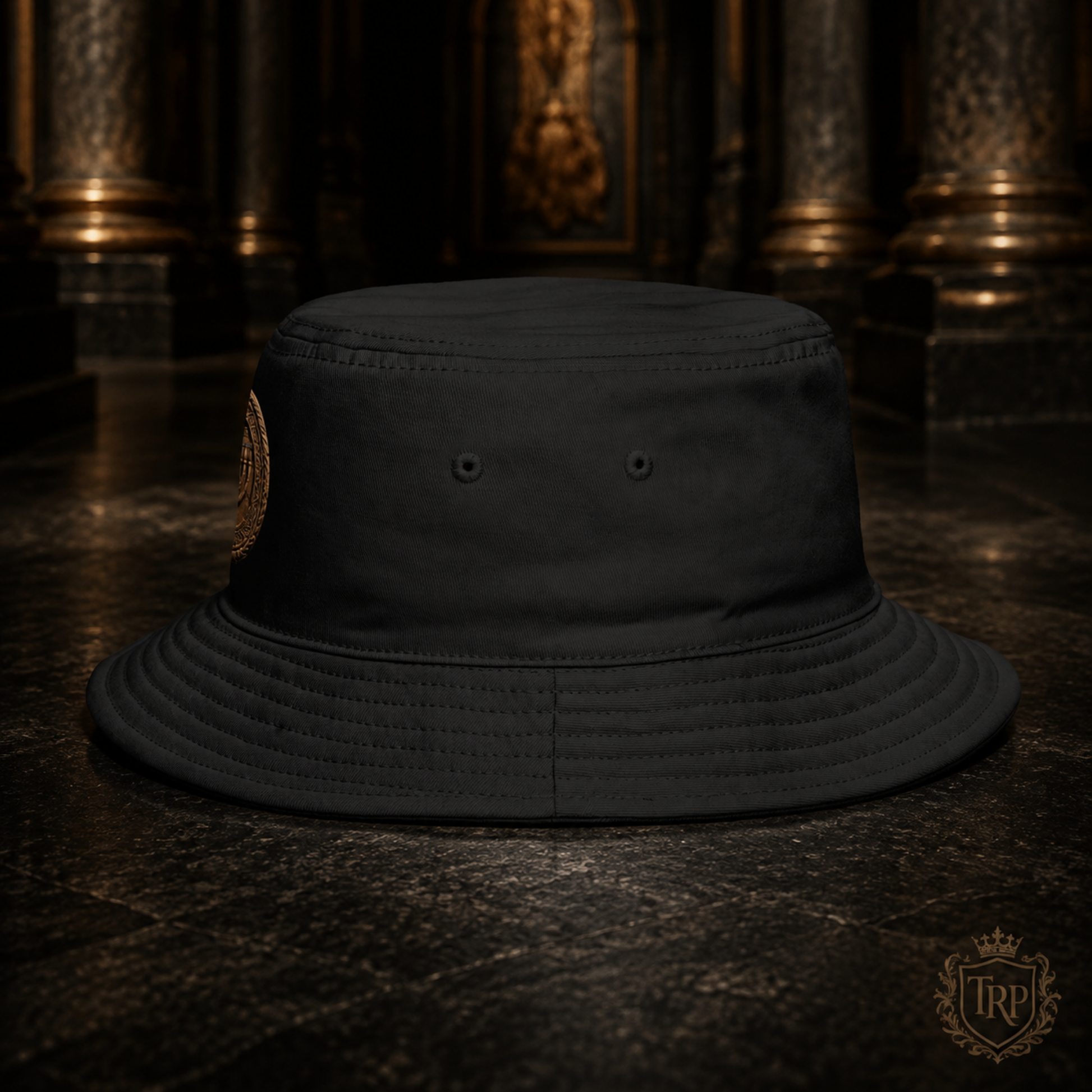 Side profile view of the black All Lives Matter bucket hat showing eyelet vents on a dark stone surface.