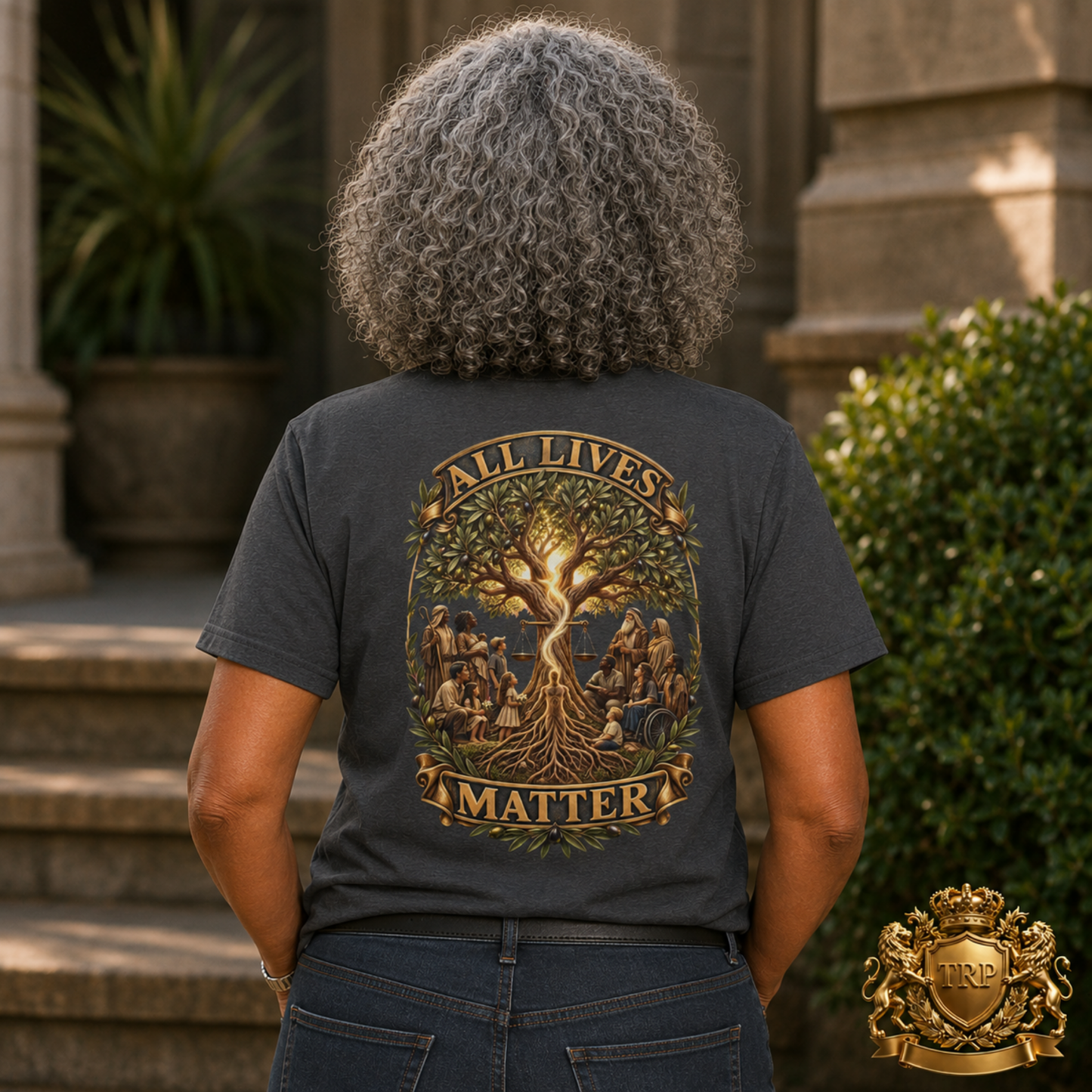 Back view of a woman wearing the charcoal grey t-shirt showing the All Lives Matter tree of life graphic design.