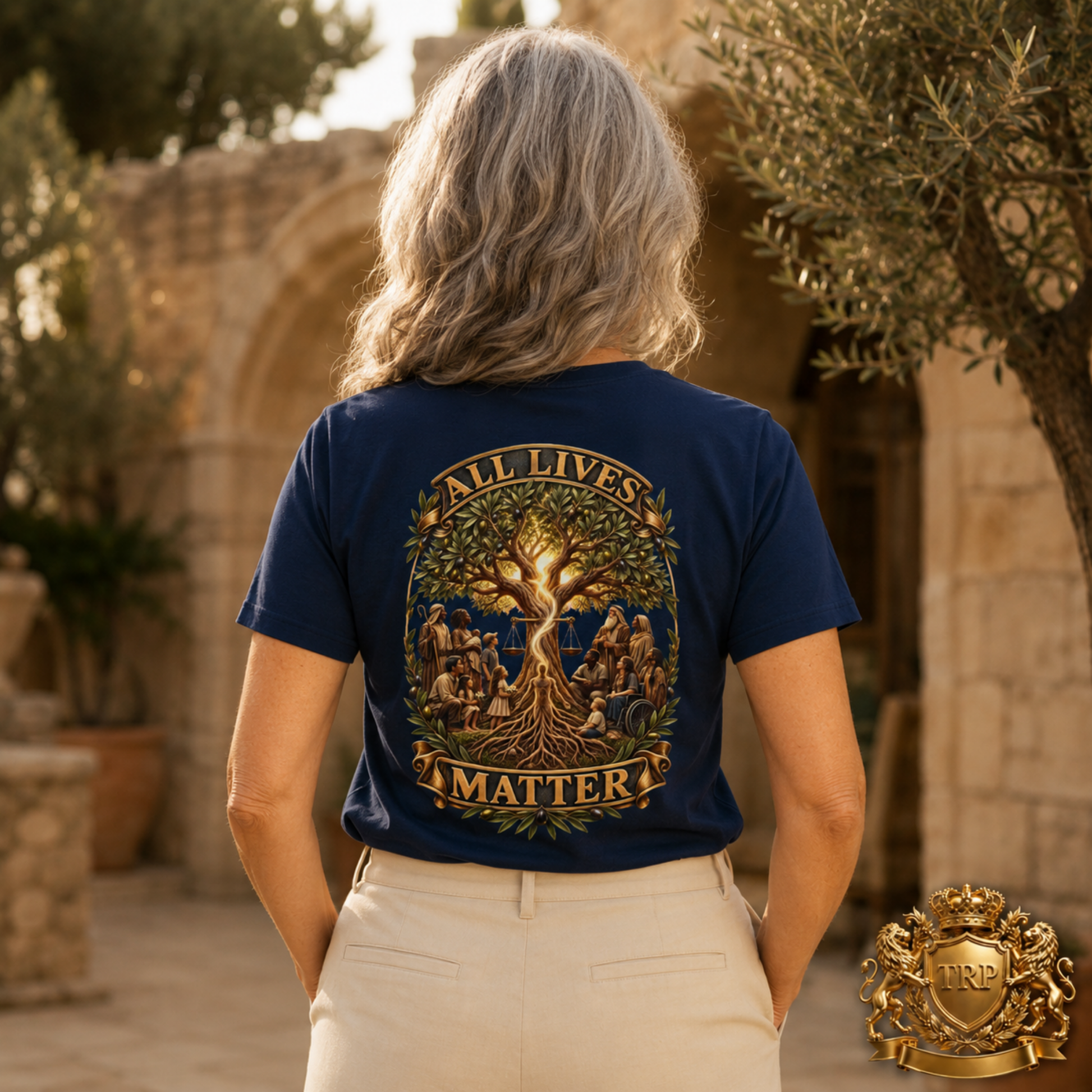 Back view of a woman wearing the navy blue t-shirt featuring the All Lives Matter tree of life artwork.