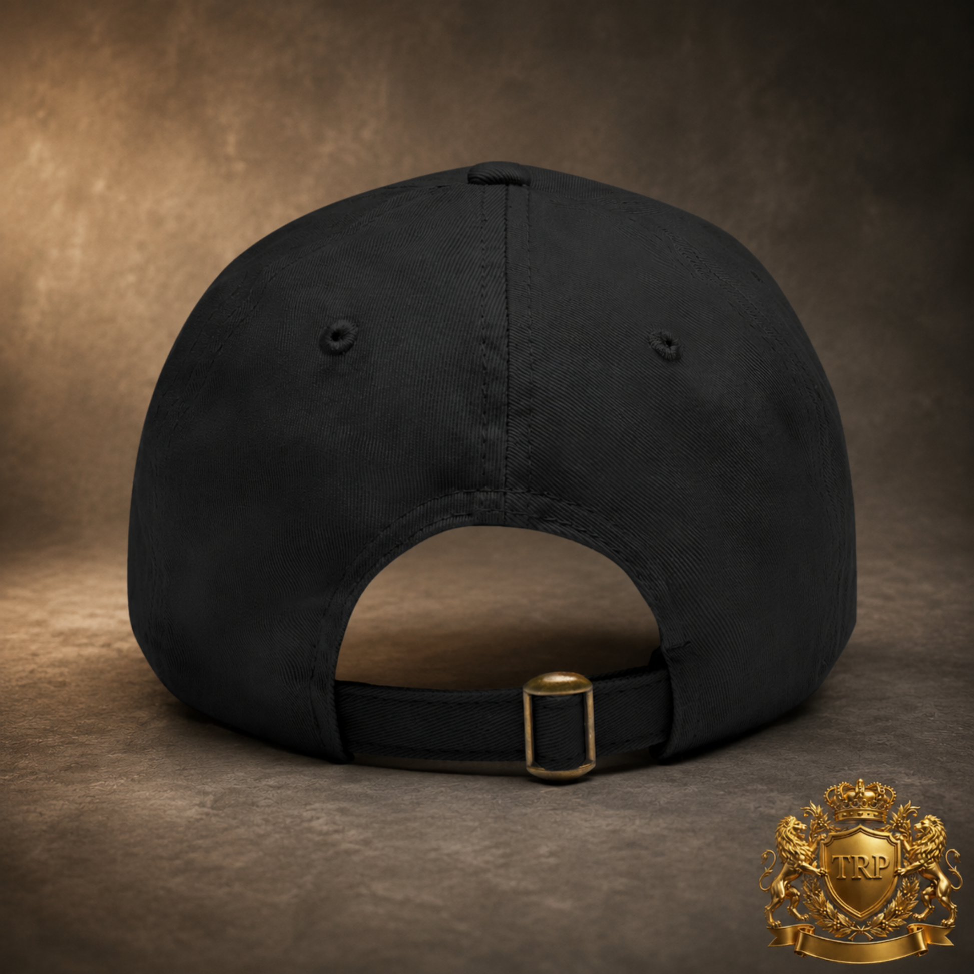 Back view of the black dad cap showing the adjustable fabric strap and antique brass buckle closure.