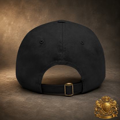 Back view of the black dad cap showing the adjustable fabric strap and antique brass buckle closure.