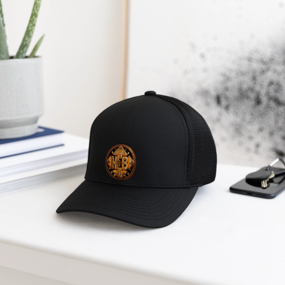 Lifestyle view of the black Hebrew World fitted baseball cap sitting on a modern white desk next to a potted plant, books, and a smartphone.