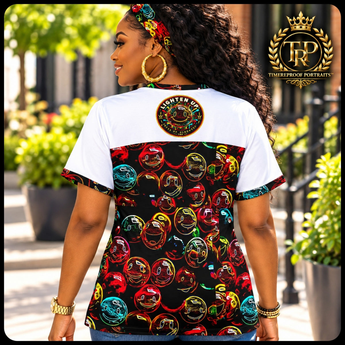 Back view of woman wearing the Lighten Up t-shirt with colorful neon smiley faces and upper back crest logo.