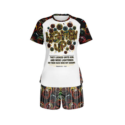 Front view of Lighten Up Psalm 34:5 women's raglan tee and matching printed shorts set featuring neon smiley faces on white background.