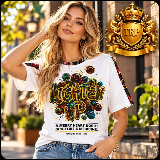 Woman wearing the Lighten Up Proverbs 17:22 white cotton T-shirt with smiley graphic, outdoors in front of a building.