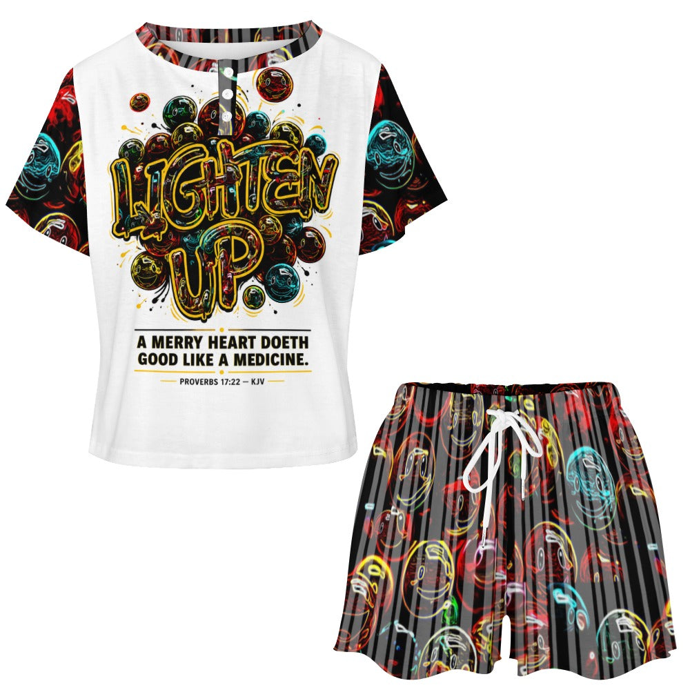 Front view of the Lighten Up lounge set featuring the graphic button-neck tee and colorful smiley face drawstring shorts