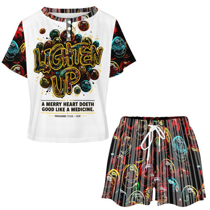 Front view of the Lighten Up lounge set featuring the graphic button-neck tee and colorful smiley face drawstring shorts