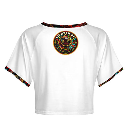 Back view of Lighten Up raglan crop top showing the circular Faces of Gladness smiley emblem on white fabric.
