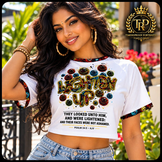 Model outdoors wearing the Lighten Up Psalm 34:5 Christian raglan crop top paired with denim jeans