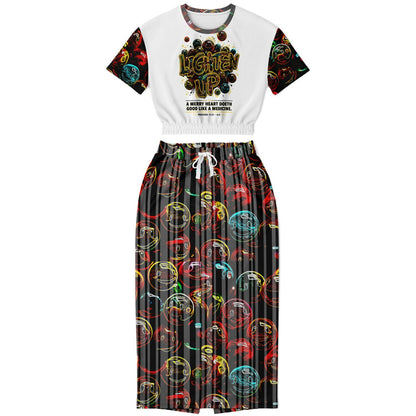Product front view: Lighten Up Proverbs 17:22 triblend cropped short-sleeve sweatshirt and smiley pocket maxi skirt set.