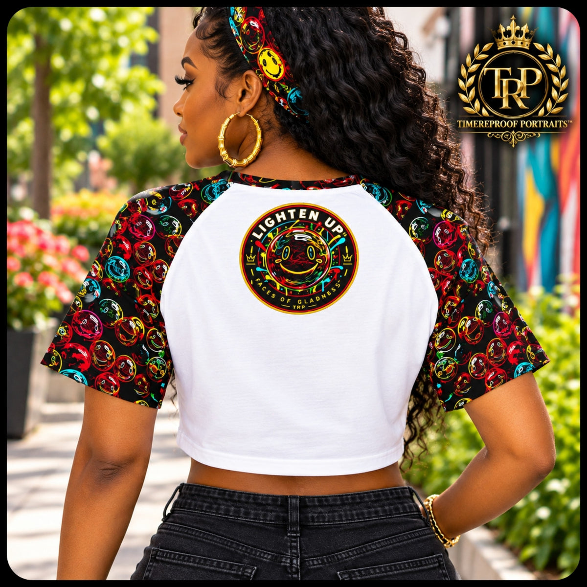 Model wearing the back view of the Lighten Up raglan crop top showcasing the circular smiley face emblem.