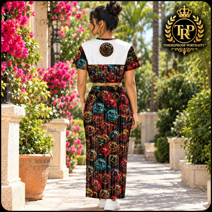 Back view of woman wearing Lighten Up Medicine of the Merry Heart cropped short-sleeve sweatshirt and printed pocket maxi skirt.