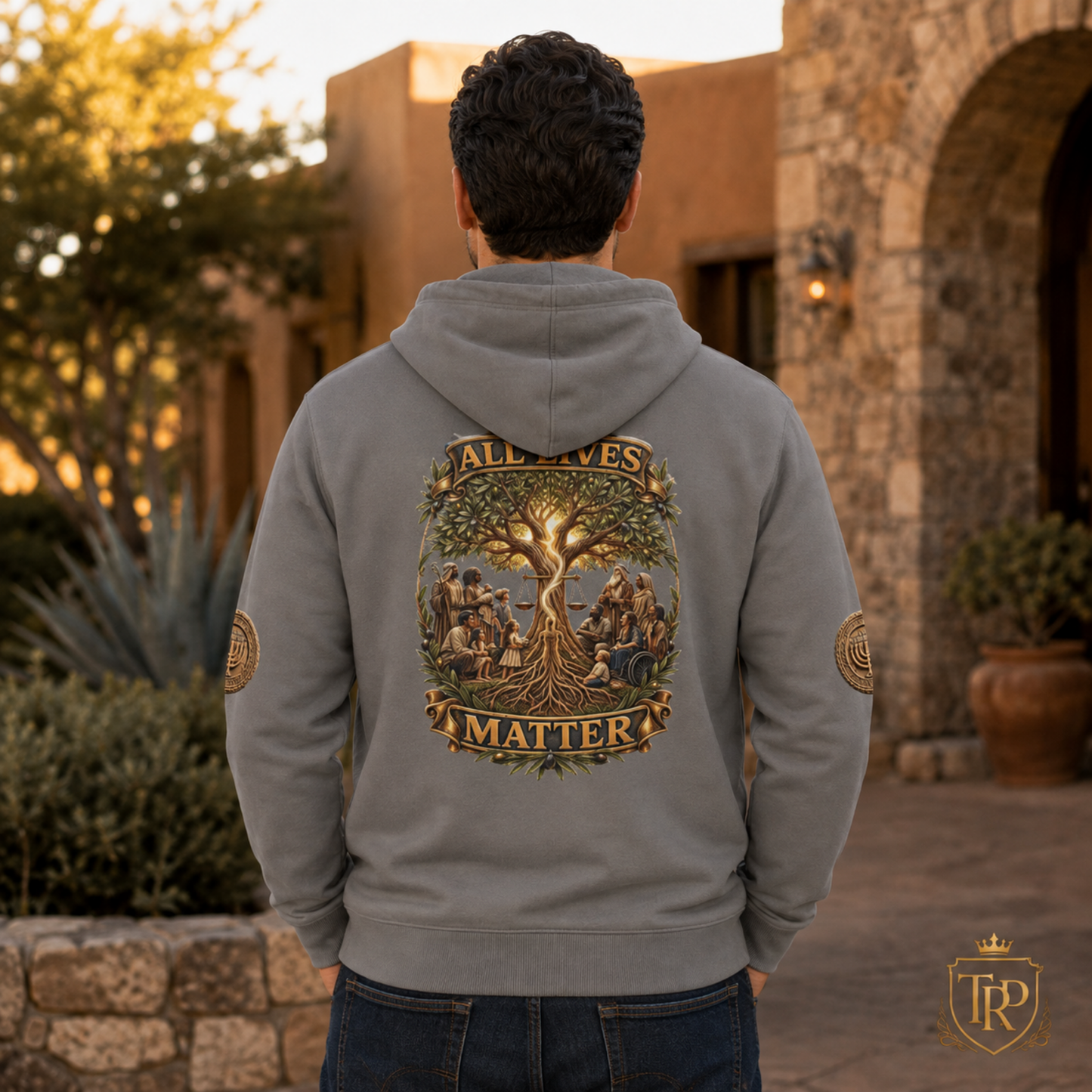 Back view of the grey relaxed zip hoodie featuring the All Lives Matter tree graphic and sleeve patches.