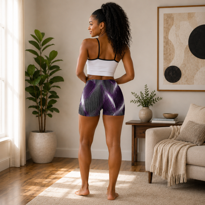 Back view of a woman wearing the OR ARGAMAN Royal Light purple and black wavy patterned legging shorts in a modern living room.