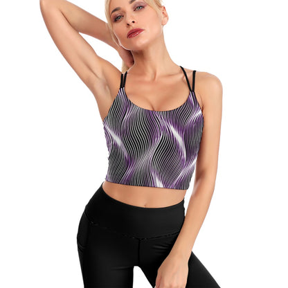 Studio front view of a model posing in the Orot Argaman royal light purple cropped open-back yoga top with black leggings.