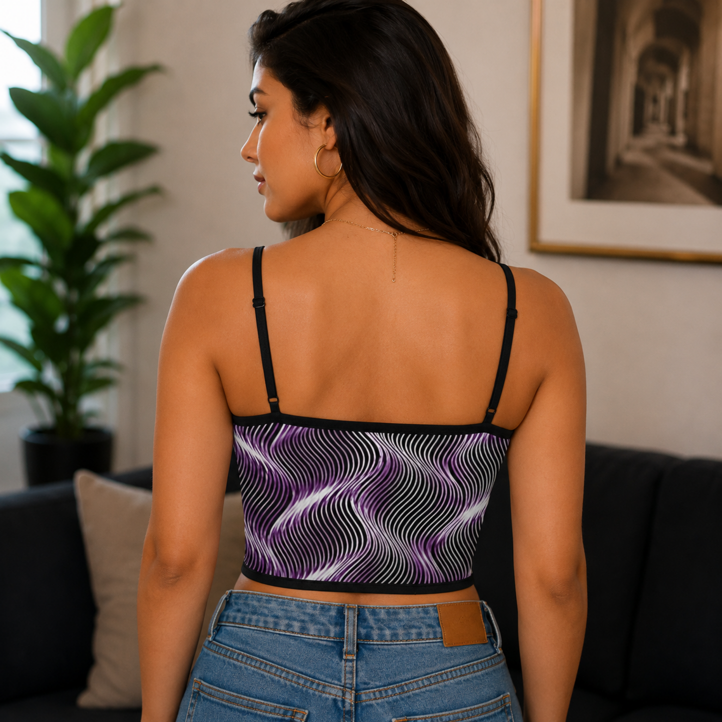 Back view of a woman wearing the Or Argaman crop top, showing the straight black neckline band and thin spaghetti straps.