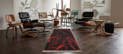 A 9.5x2.1 ft runner rug with a black and red liquid swirl pattern sits on a dark wood floor, surrounded by various mid-century modern chairs in a minimalist room.