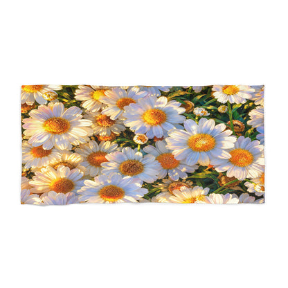 Product view of The Dawning Field beach towel displaying a dense field of blooming daisies under morning sunlight.