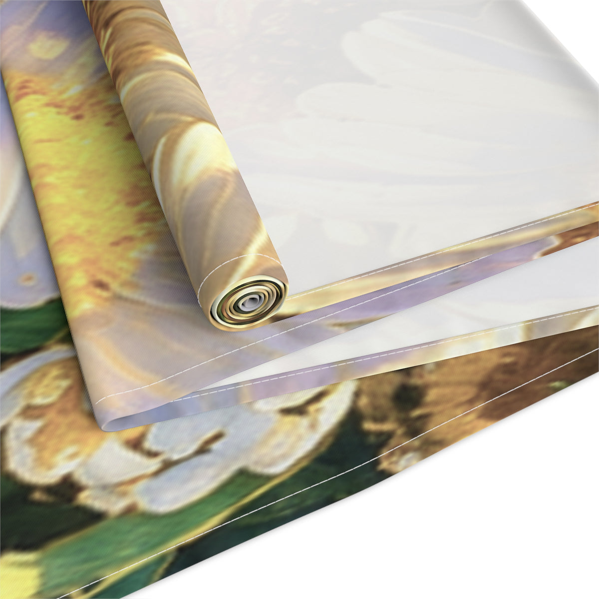 Overhead flat lay of The Dawning Field cotton twill table runner in the longer size option showing blooming daisy illustrations.