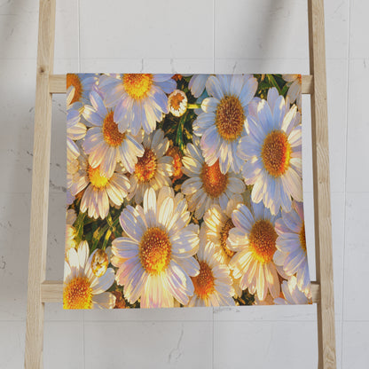 The Dawning Field floral hand towel folded neatly over a light wooden ladder rack against a white tiled bathroom wall.