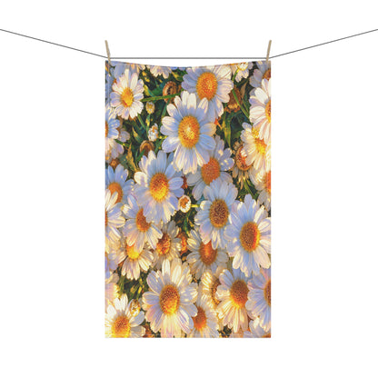 The Dawning Field kitchen hand towel with white daisy artwork hanging vertically from a clothesline with wooden pins.