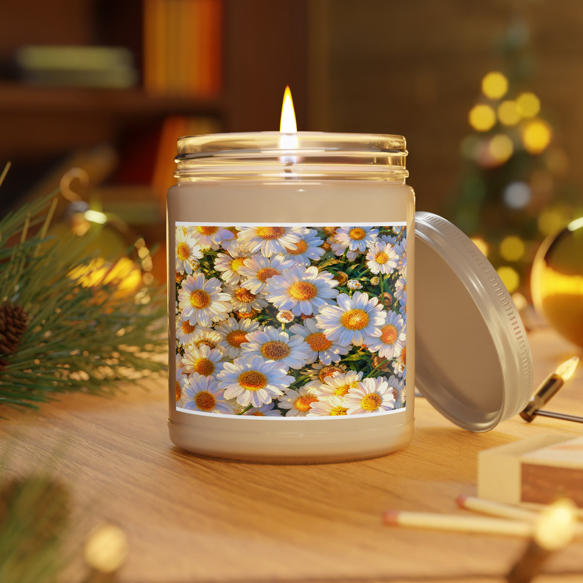 Lit The Dawning Field 9oz soy candle in a clear glass jar on a wooden table beside pine needles and festive bokeh.