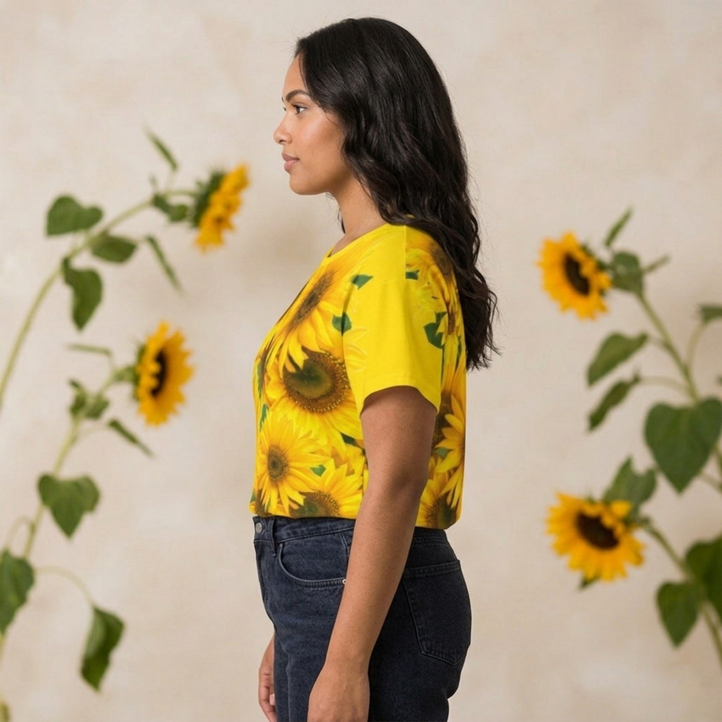 Left profile view of a woman showcasing the seamless sleeve fit and sunflower graphic print on the cyber yellow t-shirt.