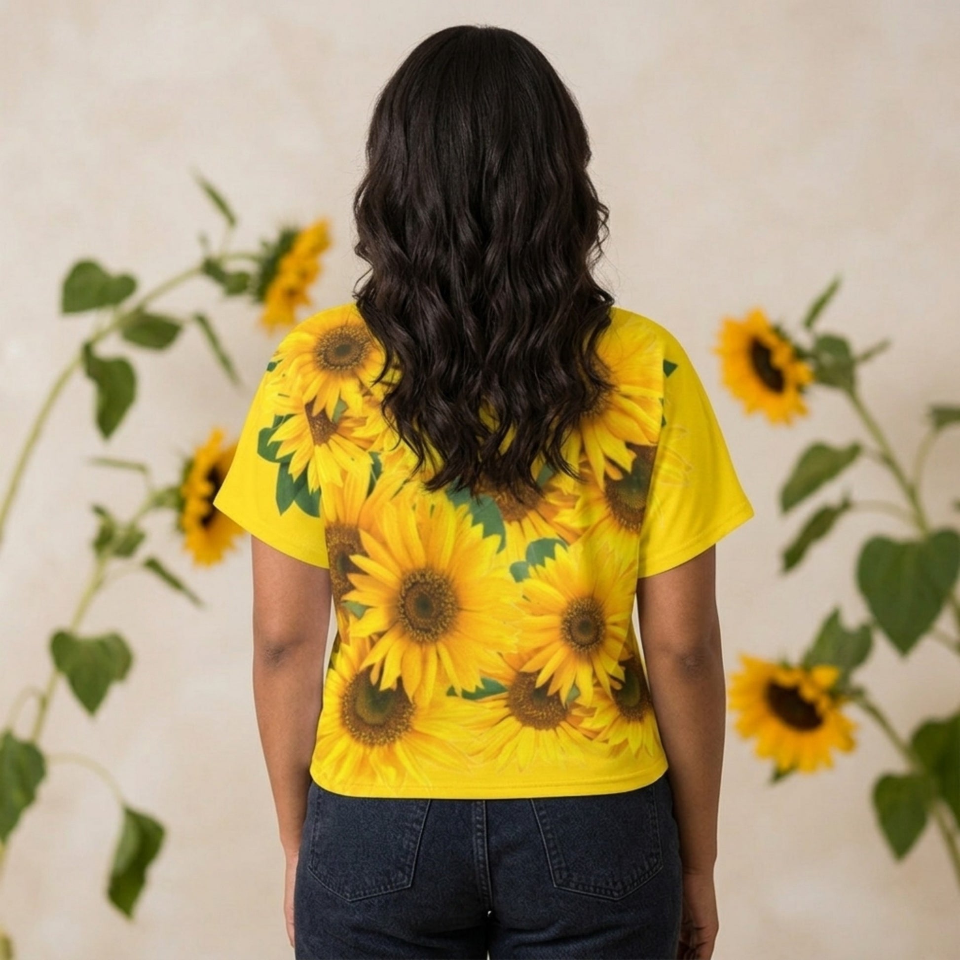Rear view of a woman showing the full-coverage yellow sunflower pattern across the back of the cyber yellow batwing sleeve tee.