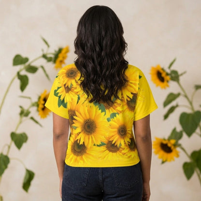 Rear view of a woman showing the full-coverage yellow sunflower pattern across the back of the cyber yellow batwing sleeve tee.