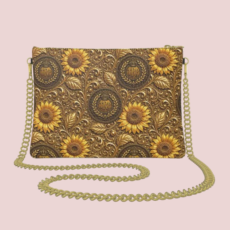 The back of the textured Nappa leather bag featuring a seamless micro-repeat pattern of embossed golden sunflowers and circular TRP insignias.