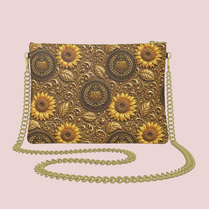 The back of the textured Nappa leather bag featuring a seamless micro-repeat pattern of embossed golden sunflowers and circular TRP insignias.