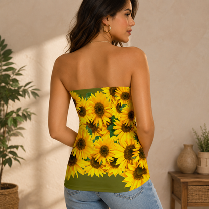 Back view of a woman wearing an olive green strapless tube top covered in a vivid yellow sunflower pattern.