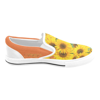 Medial profile view of TRP Sunflowers in Symmetry women's slip-on canvas shoe showing the vivid red tangelo (orange-colored) canvas trim and gold TRP logo.