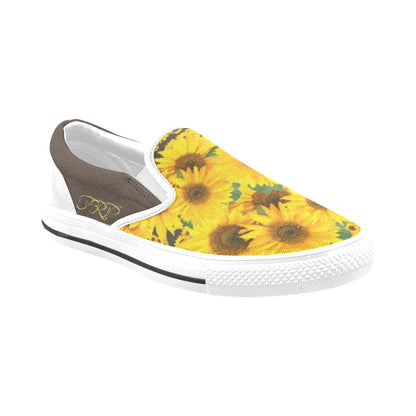 A three-quarter studio view of TRP Sunflowers in Symmetry women's slip-on canvas shoe showcasing the bistre (brown) trim and vibrant yellow floral print toe box.