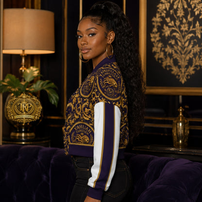 Left side view of a model wearing the purple and gold Yahuah Yahusha cropped drop-shoulder varsity jacket with striped sleeves.