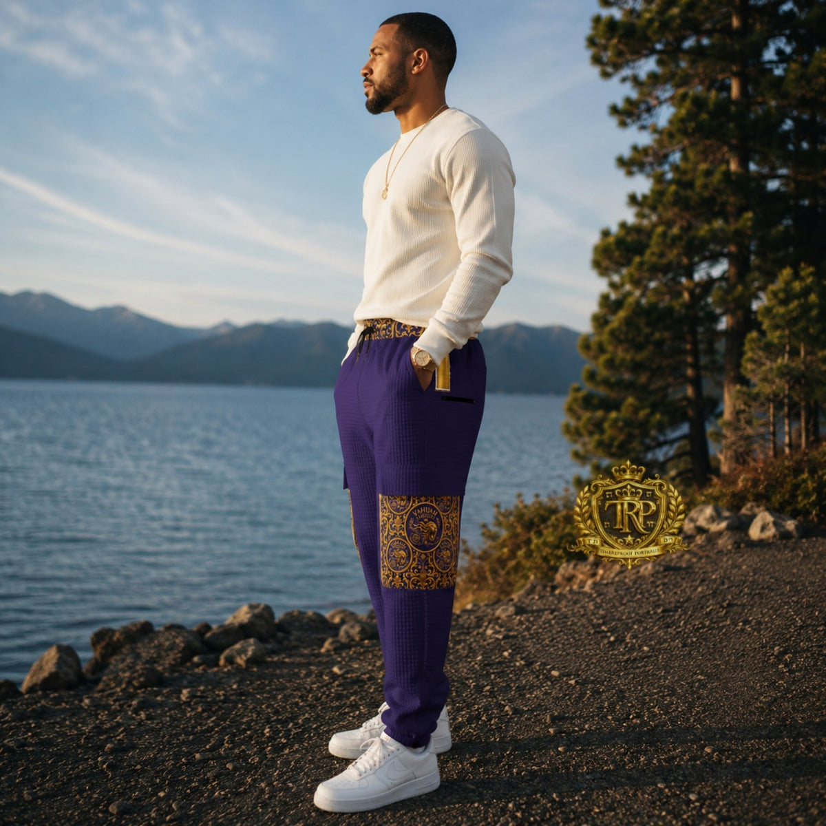 Left side profile view of a man wearing purple Yahuah Yahusha lantern cargo joggers featuring detailed pocket art.