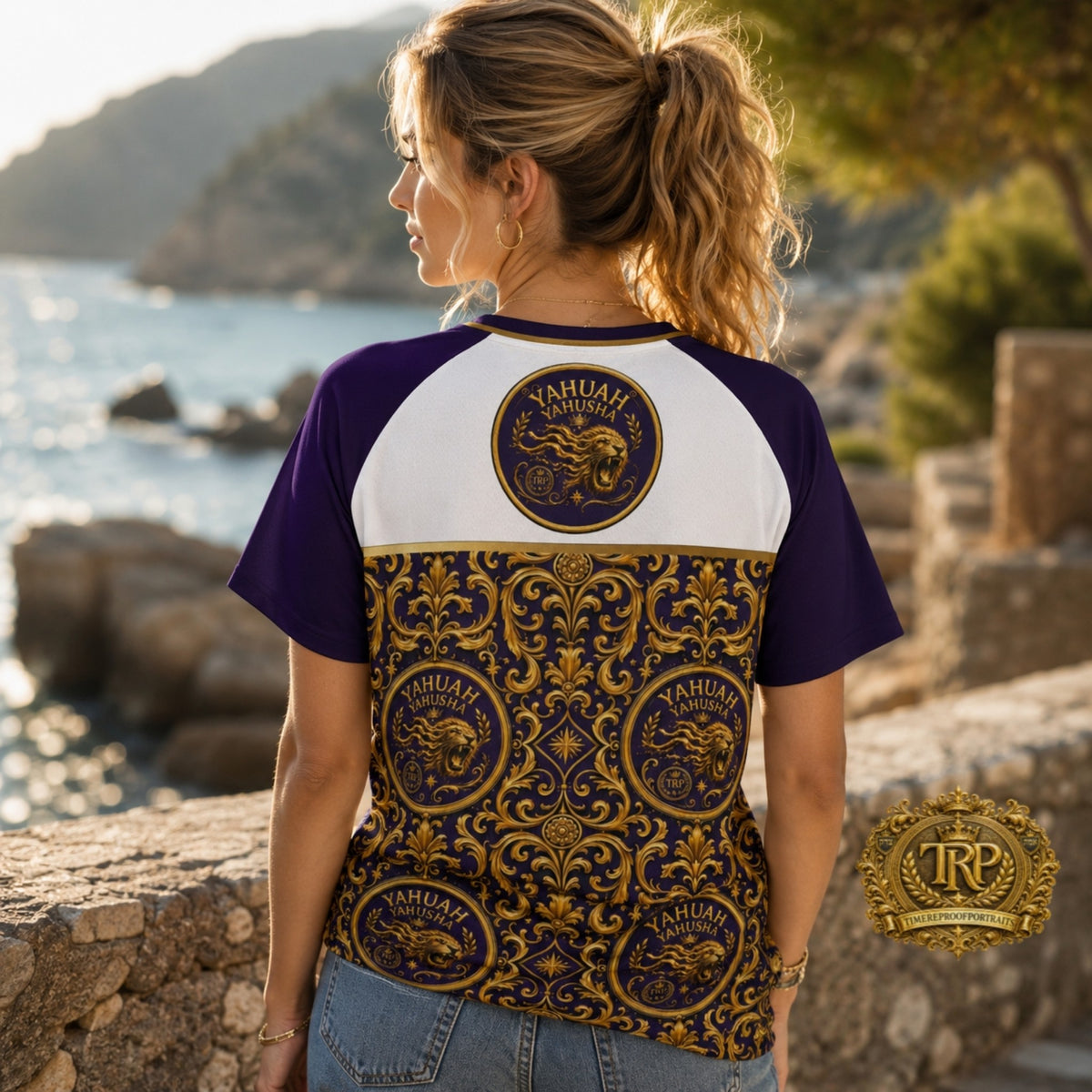 Back view of woman by the sea wearing Yahuah Yahusha unisex raglan mesh shirt with intricate gold baroque lion emblems.