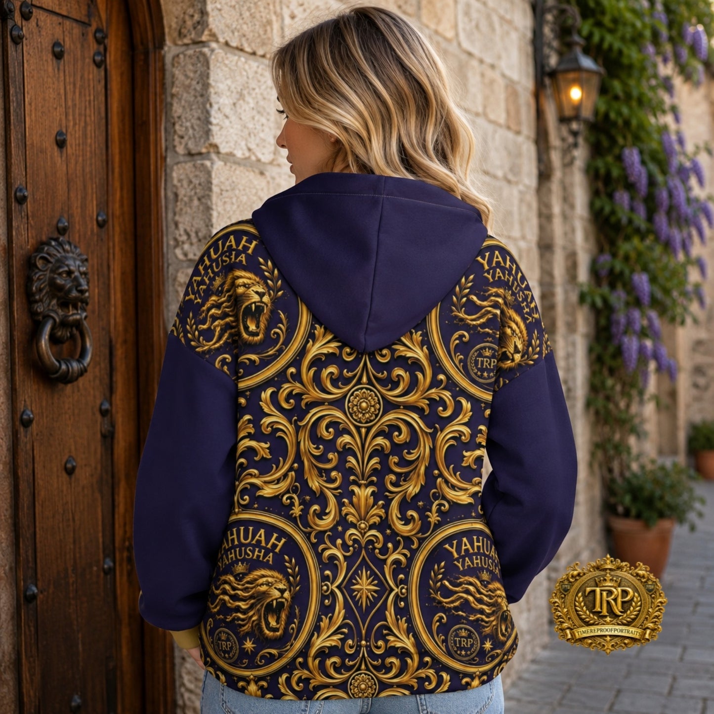 Back view of a model wearing the Yahuah Yahusha gold ornate lion zip hoodie with plain purple hood and sleeves.