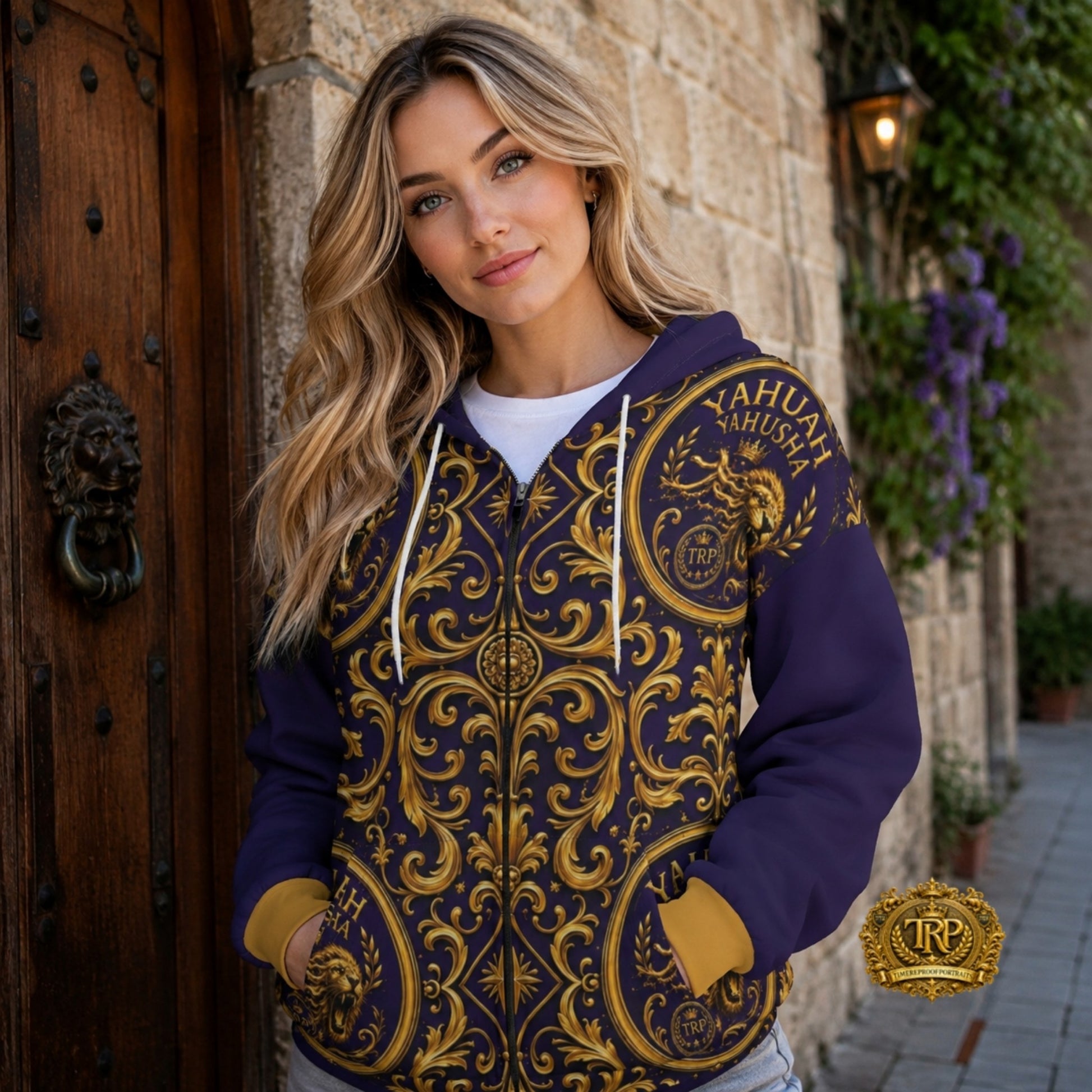 Model wearing a dark purple and gold Baroque zip hoodie with lion crests and Yahuah Yahusha lettering, facing front.