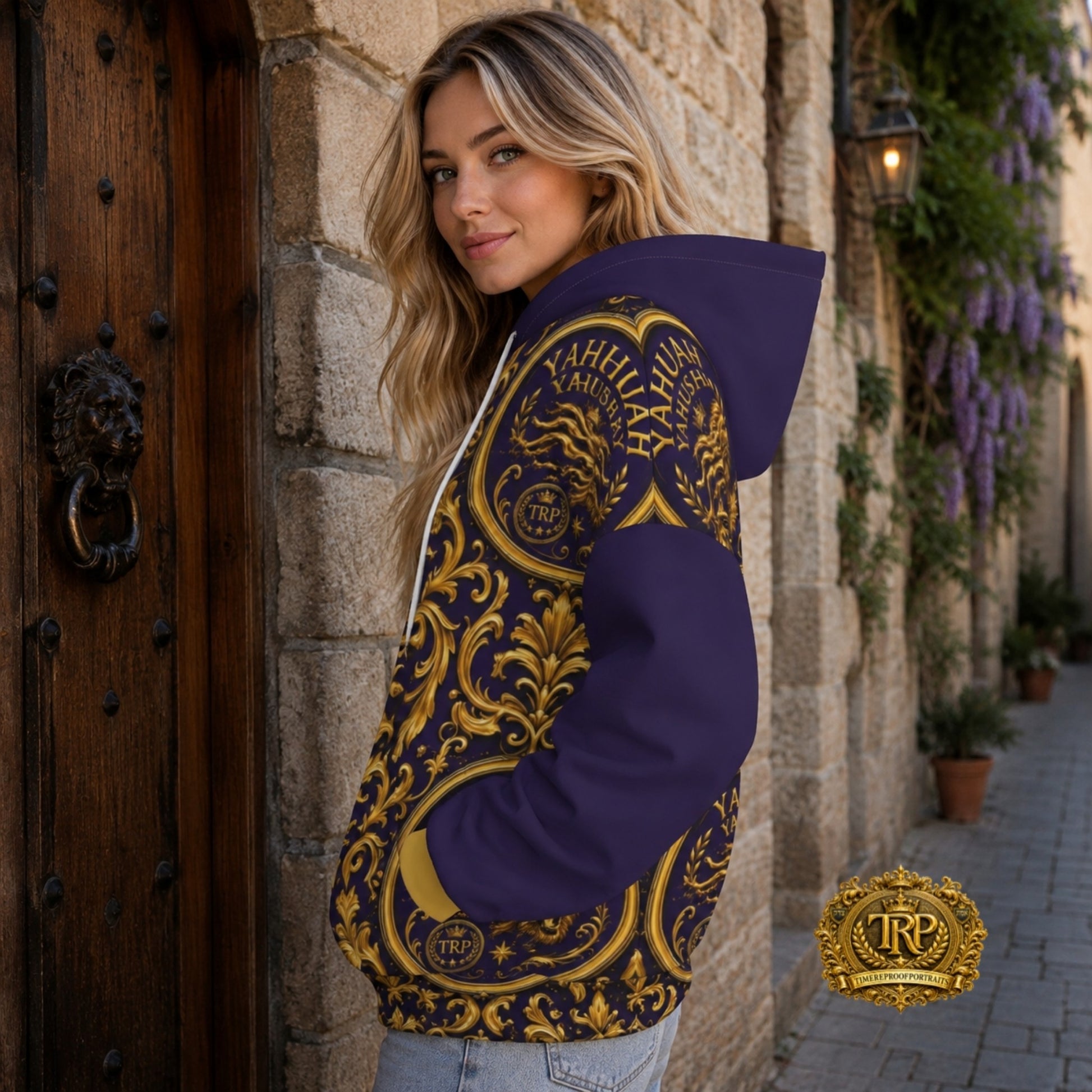 Model in a Yahuah Yahusha gold filigree and roaring lion purple hoodie shown from a left-side profile view.
